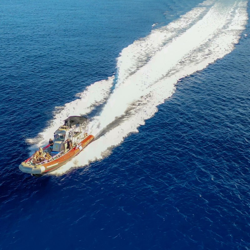 a man riding a wave on top of a body of water