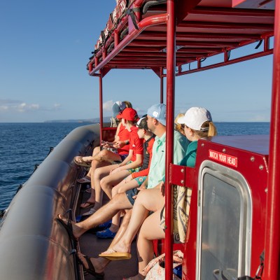 a close up of a boat next to a body of water