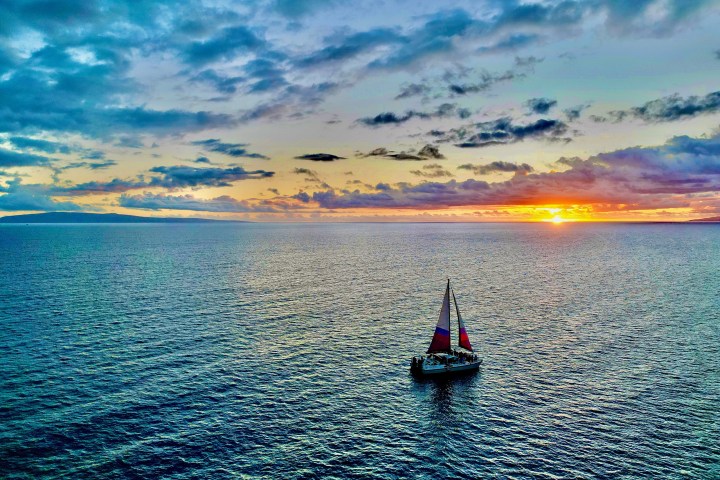 a small boat in a large body of water