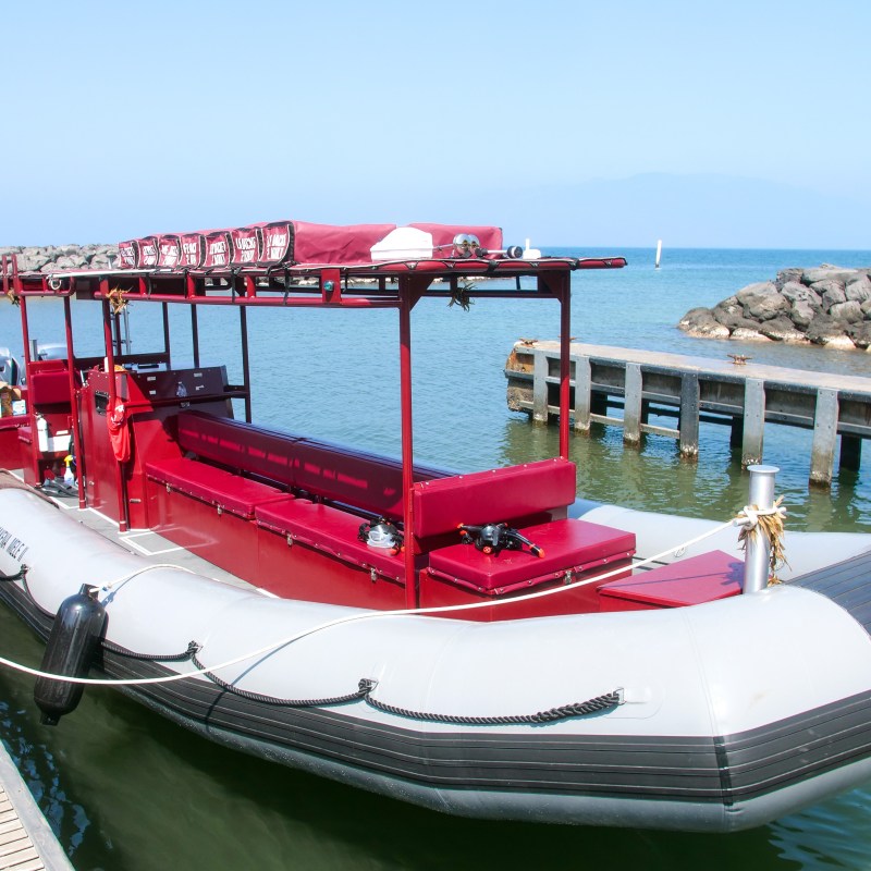 a boat is docked next to a body of water