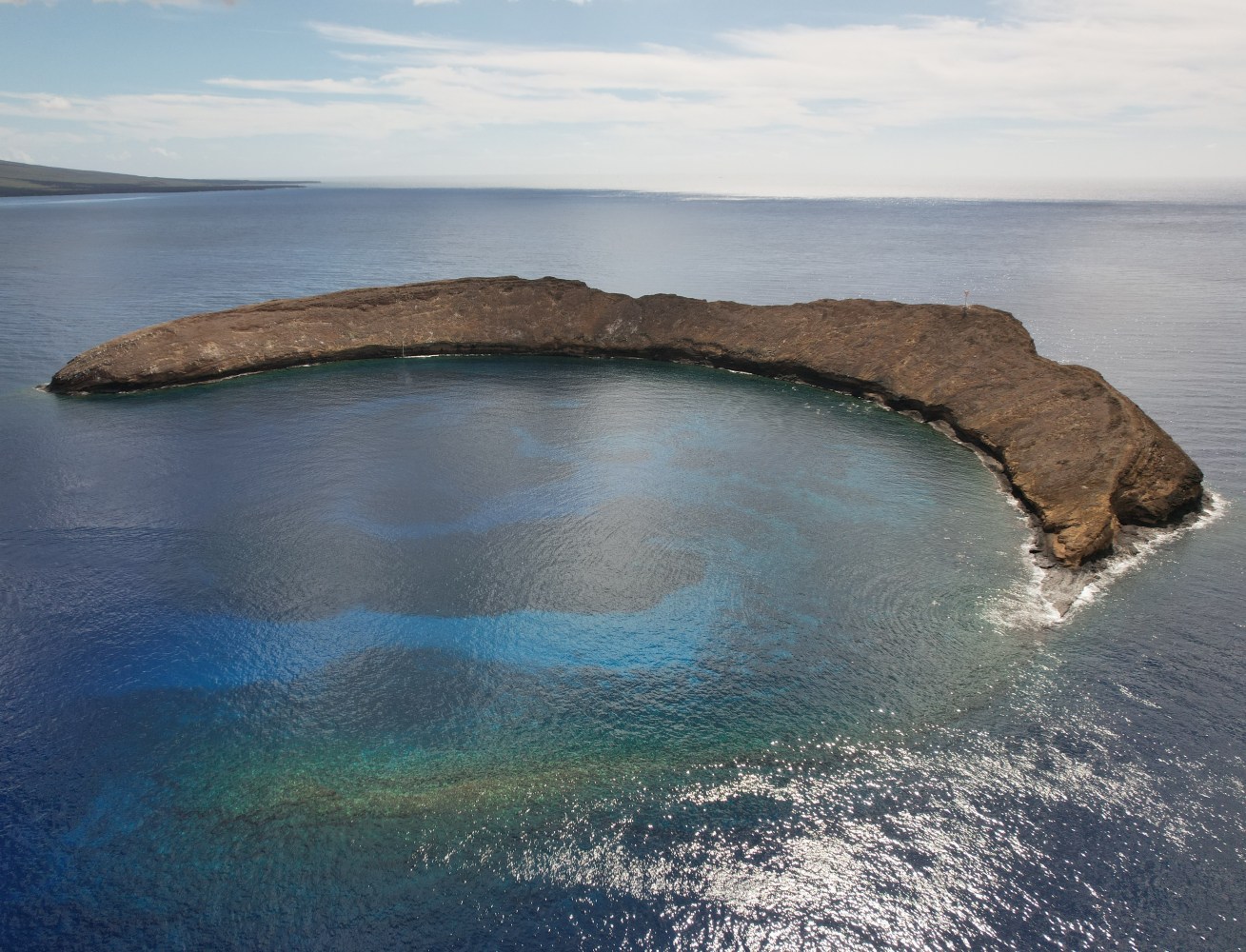 Aerial view of Molokini Crater during a snorkel tour in Maui.